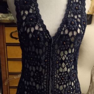 Not new,vintage navy blue crochet front with beads vest, ribbed back,size small.